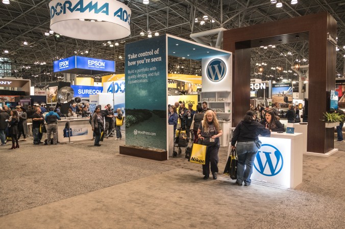 Megan, our event manager, explains WordPress.com to a conference goer.