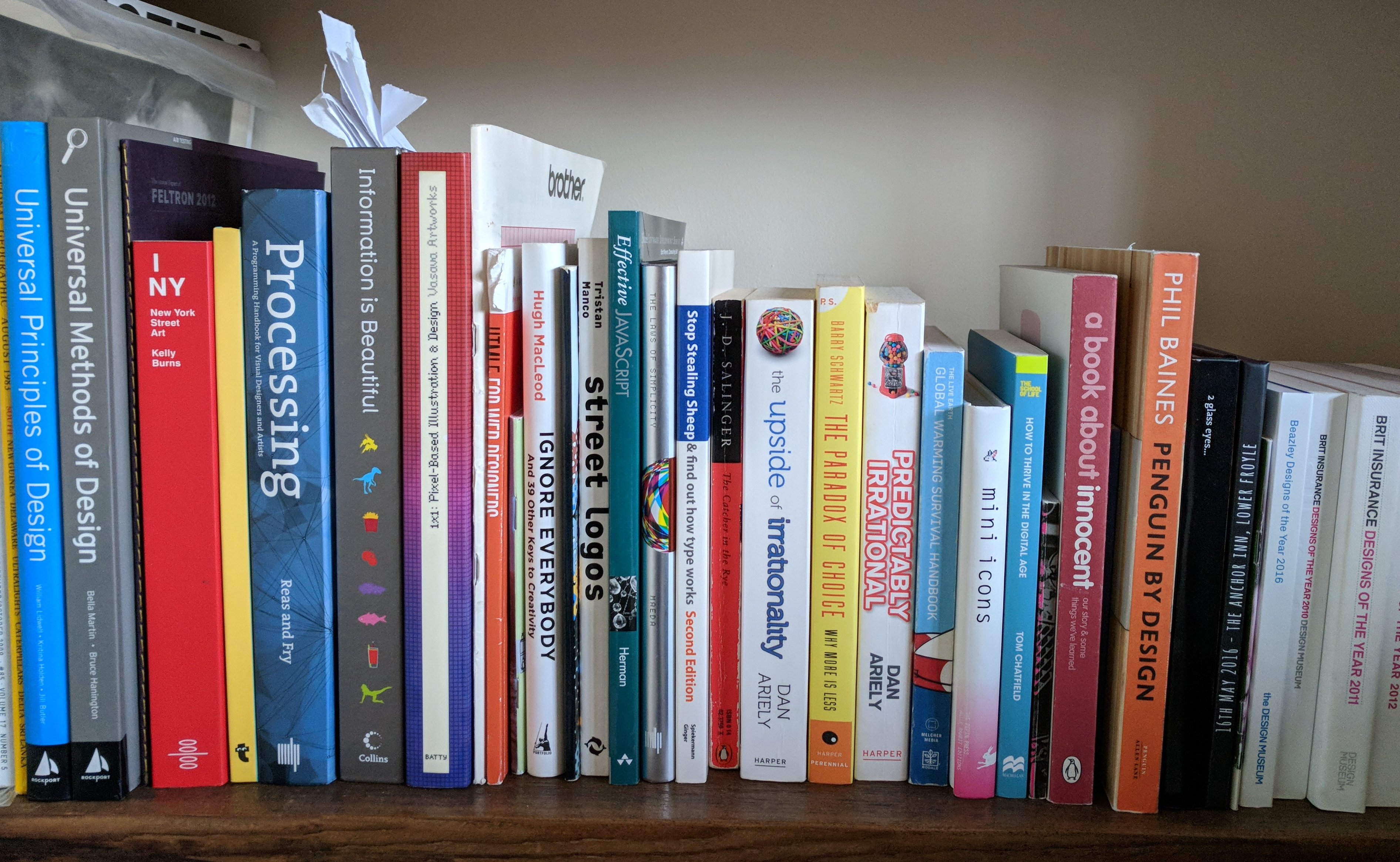 A collection of design books sitting on a shelf