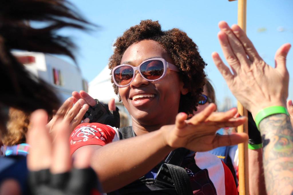 Automattician Michelle Langston congratulates teammates after completing a dragon boat race.